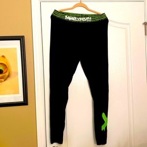 Savage X Fenty leggings with neon green details